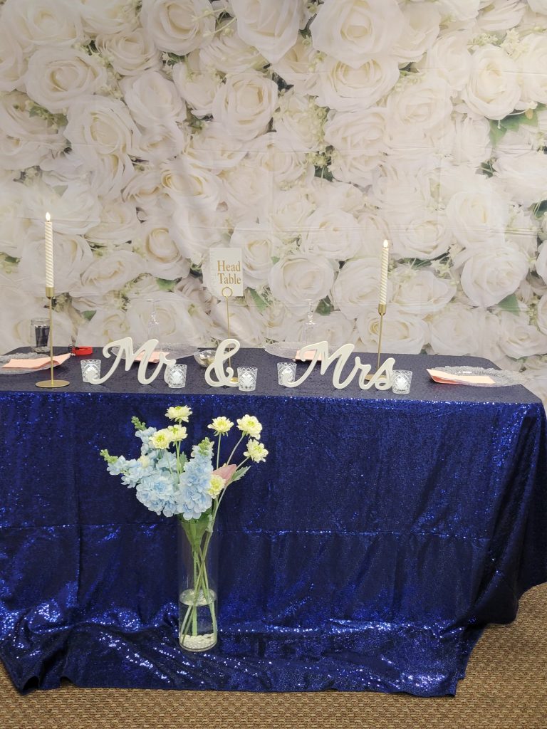 Wedding · navy and gold, rose wall · 27 March 2026