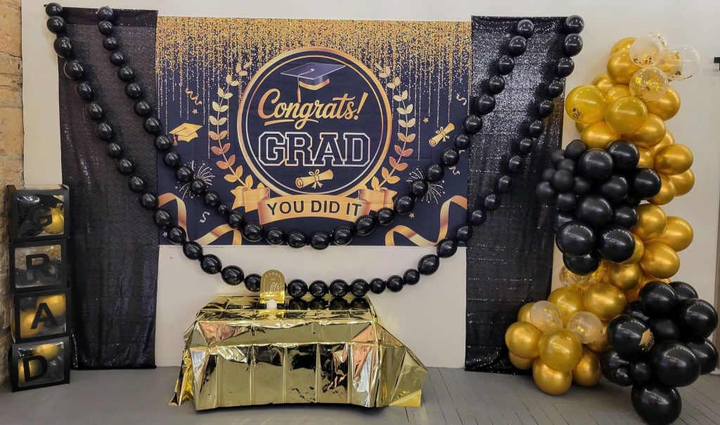 Graduation · black and gold, brick venue · 8 May 2026