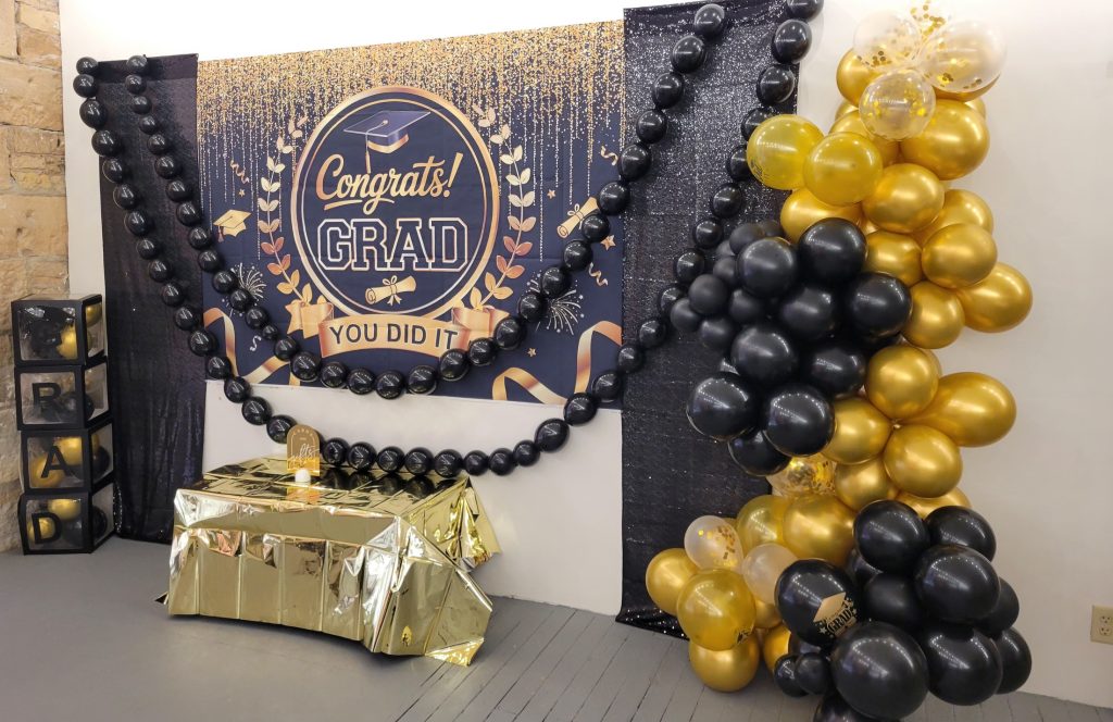 Graduation · black and gold, brick venue · 8 May 2026