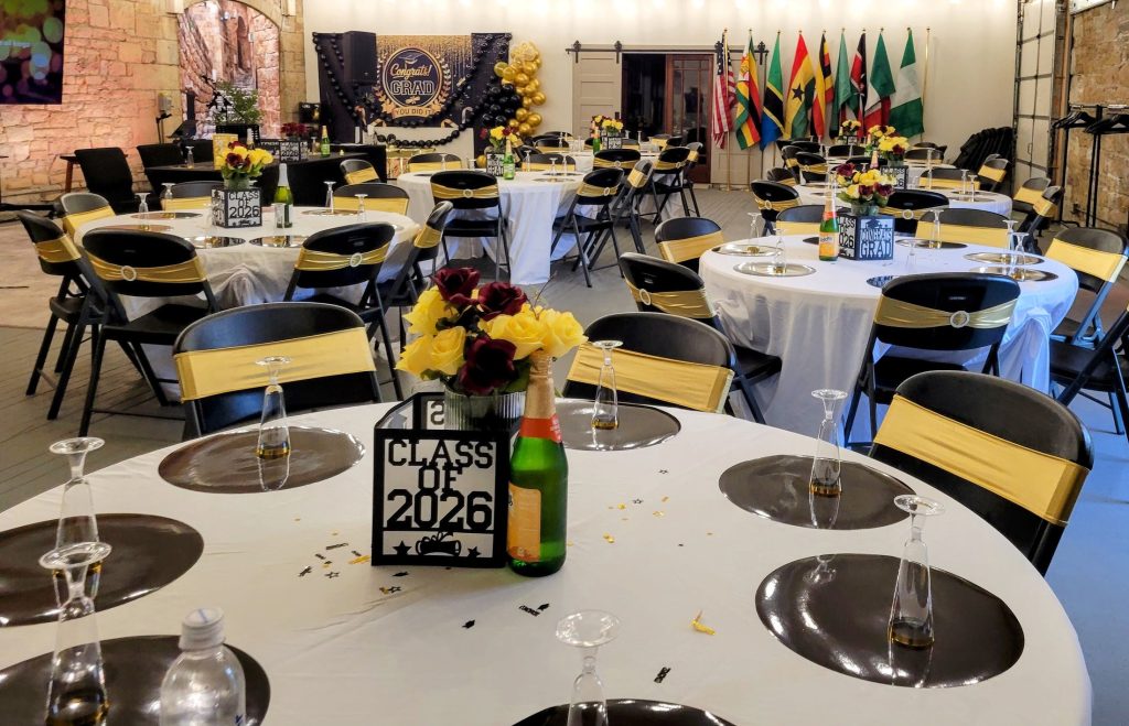 Graduation · black and gold, brick venue · 8 May 2026